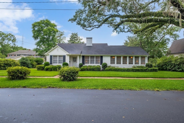 1540 Isabel Ct, Tallahassee, FL 32303 - ranch-style house with a chimney and a front yard