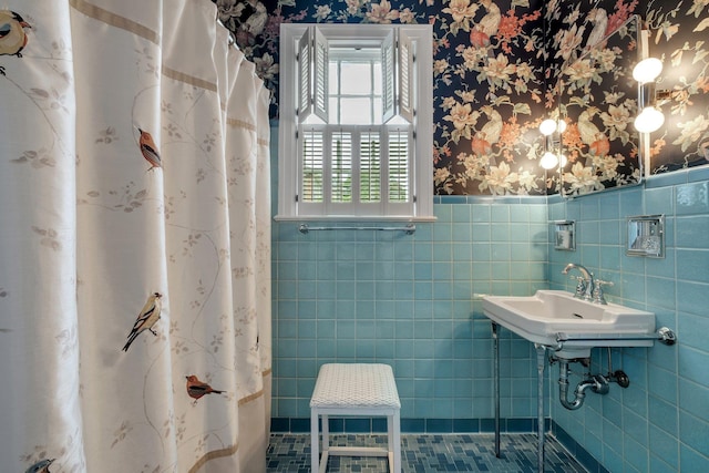 1540 Isabel Ct, Tallahassee, FL 32303 - bathroom featuring a wainscoted wall, wallpapered walls, tile walls, and a shower with shower curtain