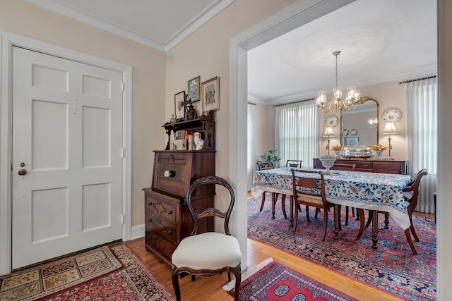1540 Isabel Ct, Tallahassee, FL 32303 - dining space with crown molding, wood finished floors, and a chandelier