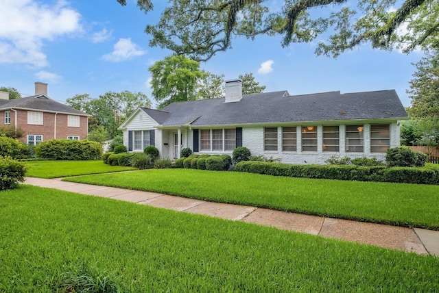 1540 Isabel Ct, Tallahassee, FL 32303 - ranch-style home featuring a front yard and a chimney