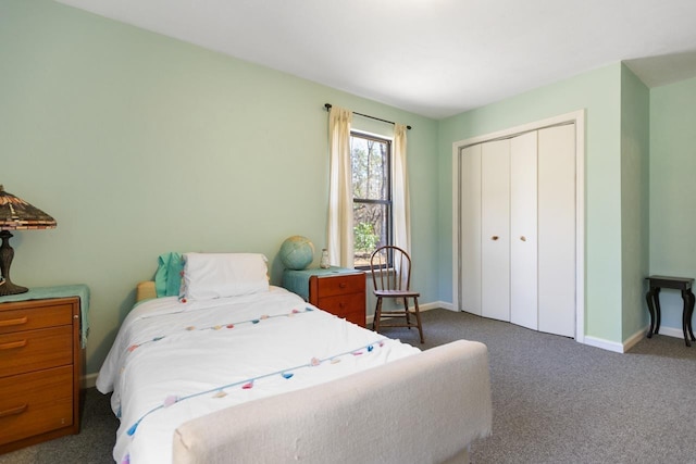 bedroom featuring dark colored carpet and a closet