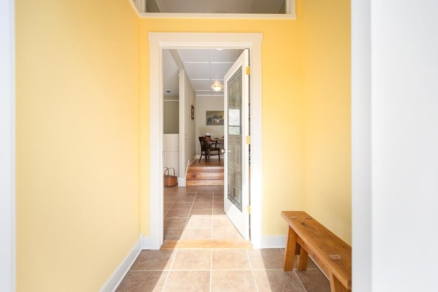 corridor with light tile patterned flooring