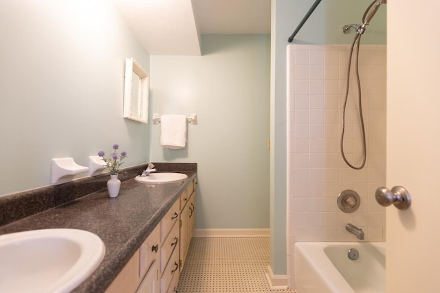 bathroom featuring vanity and tiled shower / bath combo