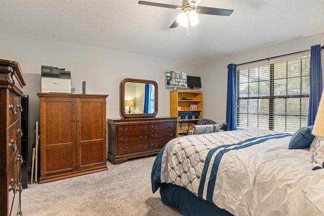 bedroom with light colored carpet and ceiling fan