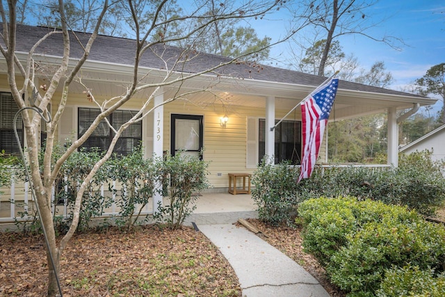 property entrance with covered porch