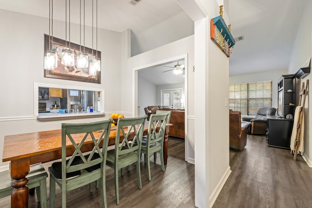 dining area featuring ceiling fan and dark hardwood / wood-style flooring