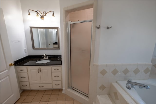 bathroom featuring tile patterned floors, vanity, and independent shower and bath