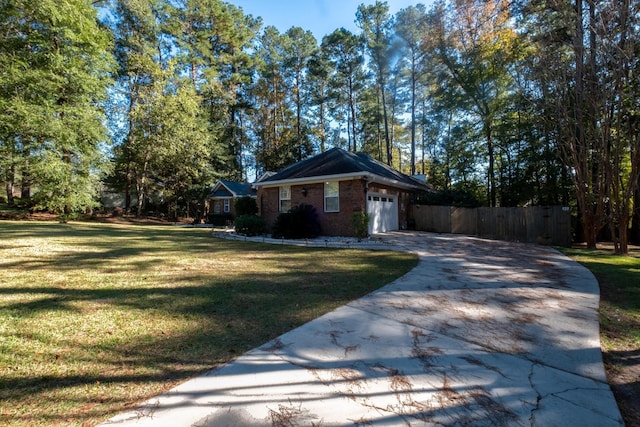 view of front facade featuring a garage and a front yard