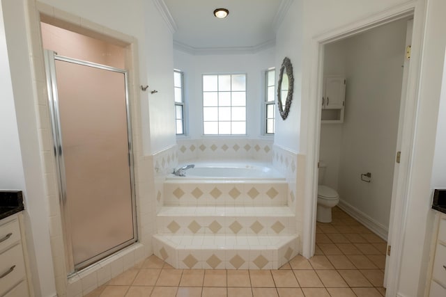 full bathroom featuring vanity, tile patterned floors, crown molding, separate shower and tub, and toilet