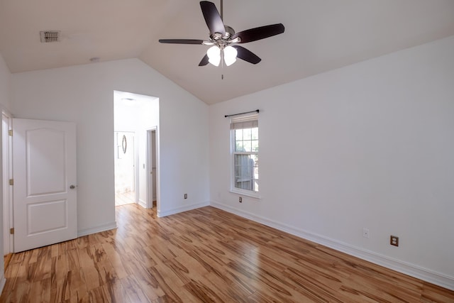 unfurnished bedroom featuring vaulted ceiling, light hardwood / wood-style flooring, and ceiling fan