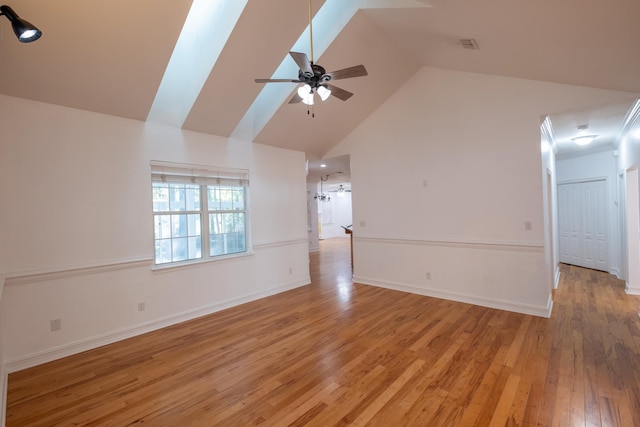 unfurnished living room featuring ceiling fan, light hardwood / wood-style floors, and high vaulted ceiling