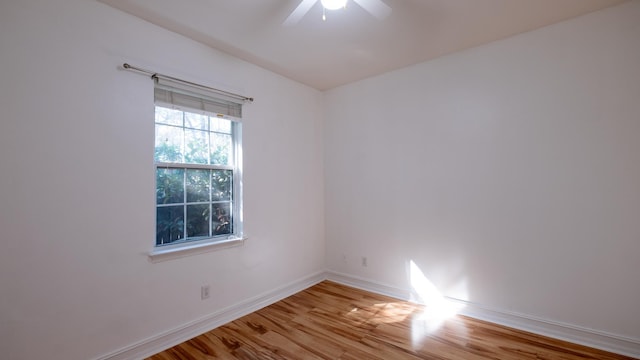 empty room featuring ceiling fan and light hardwood / wood-style floors