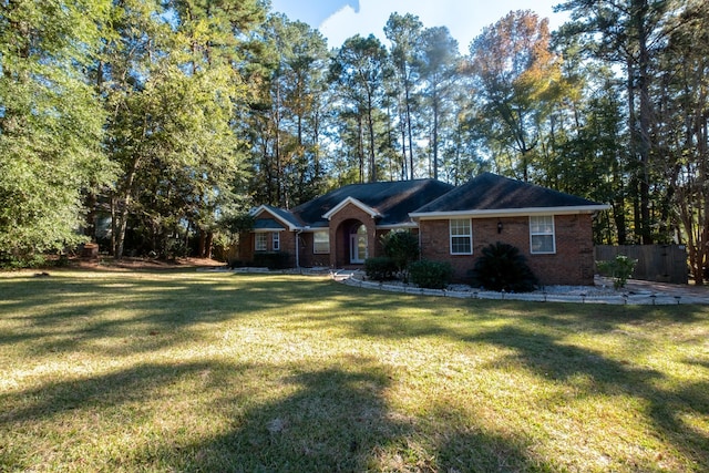 ranch-style house featuring a front yard