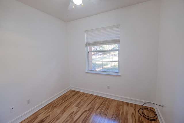 unfurnished room with ceiling fan and light wood-type flooring