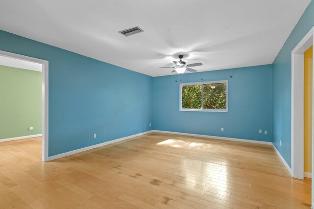 1233 Talbot Ave, Tallahassee, FL 32308 - unfurnished room with ceiling fan, light wood-style flooring, and baseboards