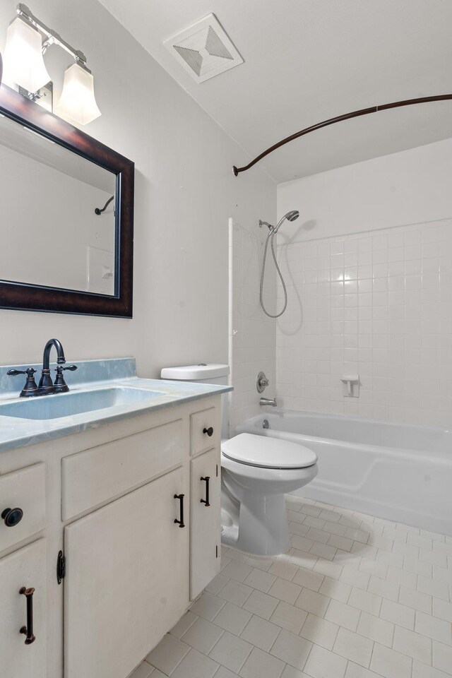 1233 Talbot Ave, Tallahassee, FL 32308 - bathroom with tile patterned flooring, vanity, shower / tub combination, and toilet