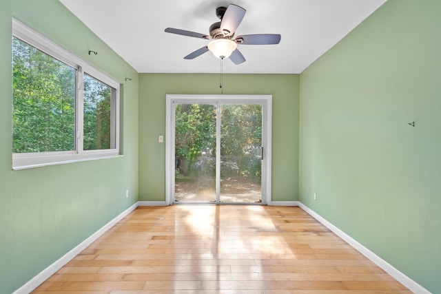 1233 Talbot Ave, Tallahassee, FL 32308 - empty room with hardwood / wood-style flooring, a ceiling fan, and baseboards
