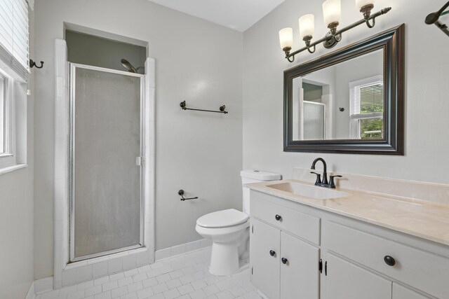 1233 Talbot Ave, Tallahassee, FL 32308 - bathroom with vanity, tile patterned floors, toilet, a shower stall, and baseboards