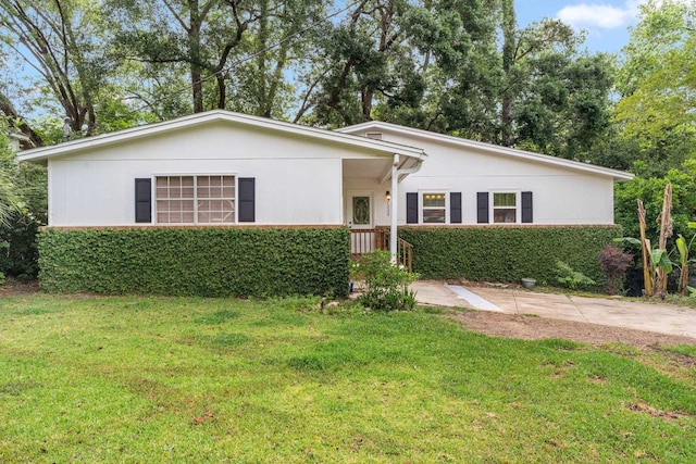 1233 Talbot Ave, Tallahassee, FL 32308 - ranch-style house featuring a front lawn and stucco siding