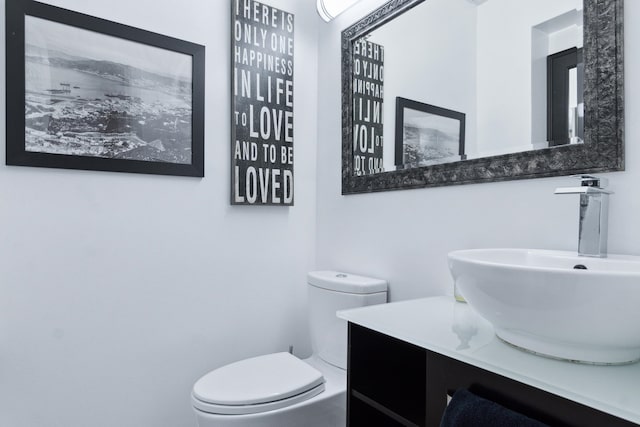 bathroom with vanity and toilet