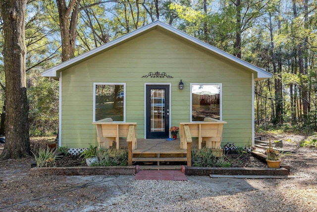 bungalow featuring a wooden deck