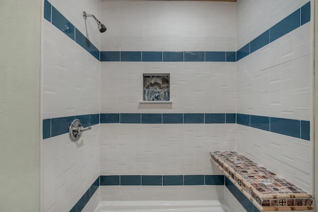 bathroom with a tile shower