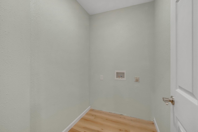 laundry area featuring hookup for a washing machine and hardwood / wood-style floors