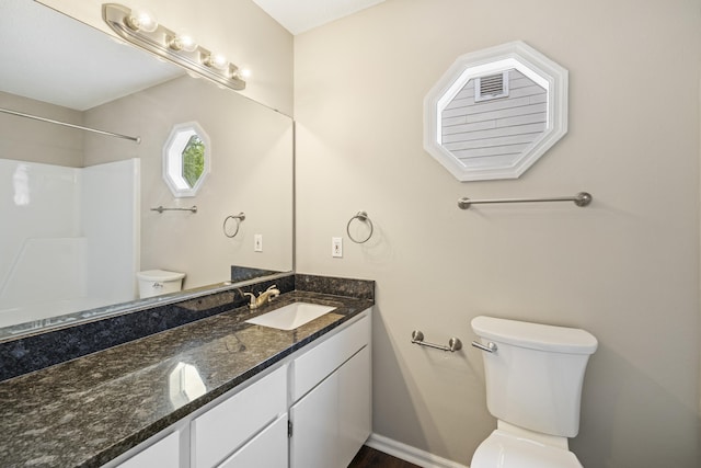3068 Royal Palm Way, Tallahassee, FL 32309 - bathroom featuring toilet, vanity, a shower, wood finished floors, and baseboards