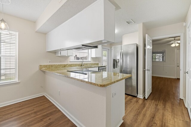 3068 Royal Palm Way, Tallahassee, FL 32309 - kitchen featuring stainless steel appliances, dark wood-type flooring, a peninsula, and light stone counters