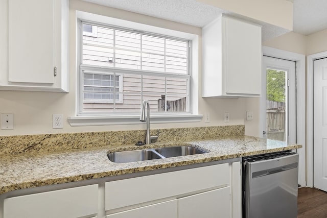 3068 Royal Palm Way, Tallahassee, FL 32309 - kitchen featuring stainless steel dishwasher, a sink, white cabinets, and light stone countertops