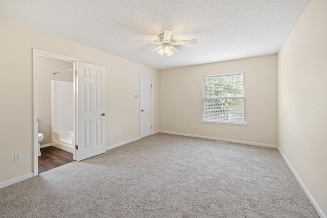 3068 Royal Palm Way, Tallahassee, FL 32309 - unfurnished bedroom featuring carpet, a textured ceiling, ensuite bath, baseboards, and a ceiling fan