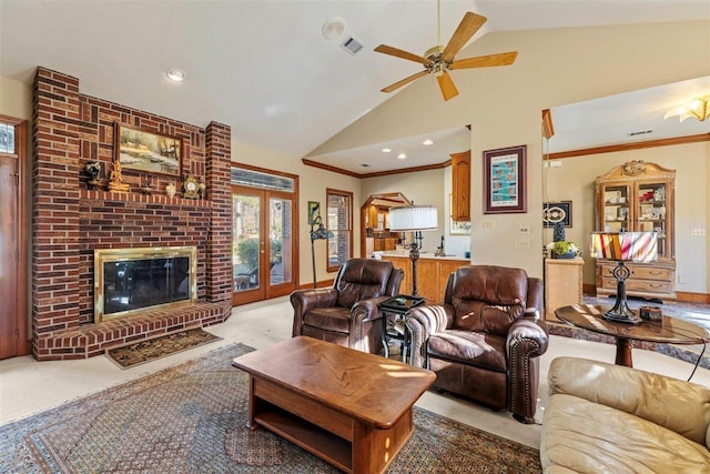 carpeted living room with french doors, vaulted ceiling, ornamental molding, ceiling fan, and a fireplace