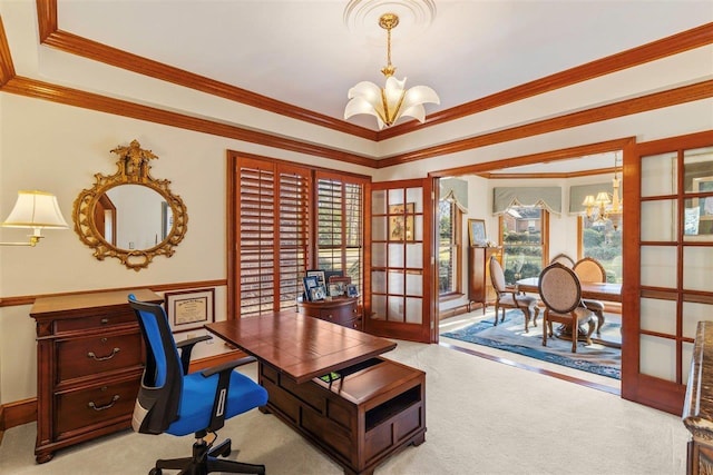 office space featuring plenty of natural light, light colored carpet, and an inviting chandelier