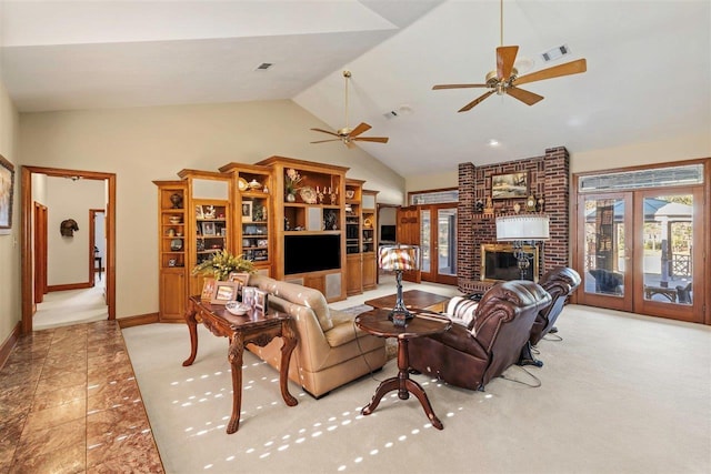 living room with vaulted ceiling, ceiling fan, a fireplace, and french doors