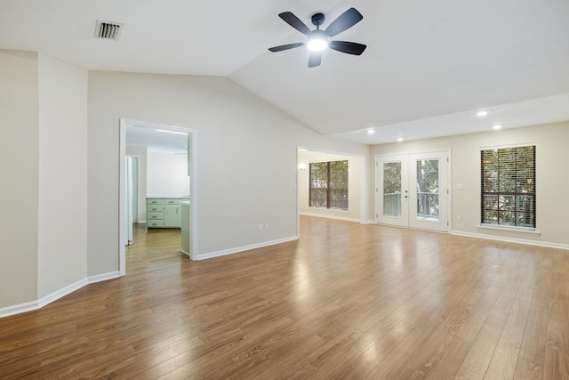 8352 Chickasaw Trl, Tallahassee, FL 32312 - unfurnished living room with a ceiling fan, light wood-style floors, vaulted ceiling, recessed lighting, and baseboards
