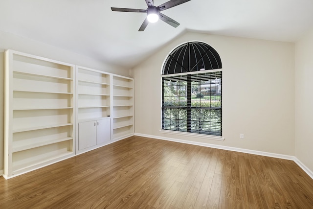 8352 Chickasaw Trl, Tallahassee, FL 32312 - empty room with a ceiling fan, wood finished floors, baseboards, and lofted ceiling