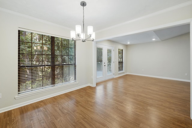 8352 Chickasaw Trl, Tallahassee, FL 32312 - unfurnished dining area with a chandelier, wood finished floors, baseboards, french doors, and ornamental molding