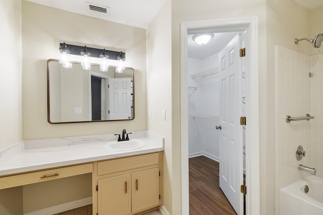 8352 Chickasaw Trl, Tallahassee, FL 32312 - full bath featuring vanity, bathing tub / shower combination, wood finished floors, and a spacious closet