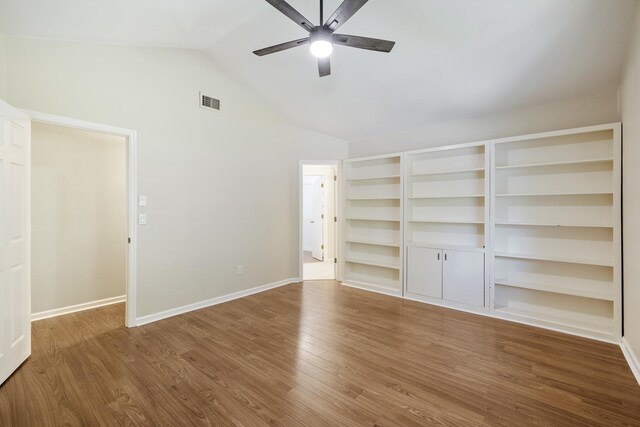 8352 Chickasaw Trl, Tallahassee, FL 32312 - unfurnished bedroom featuring wood finished floors, lofted ceiling, baseboards, and a ceiling fan