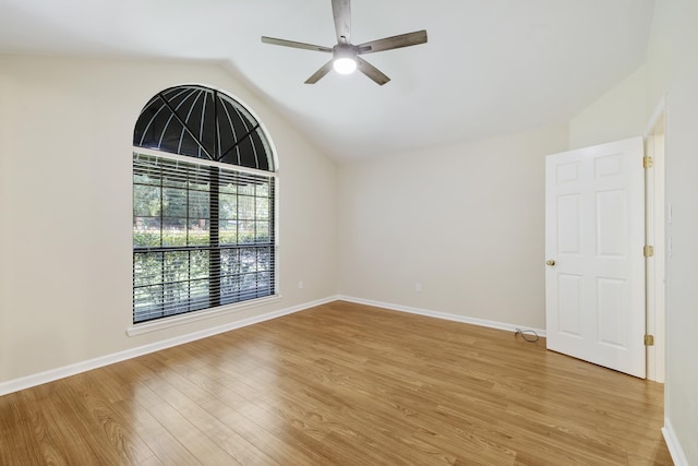 8352 Chickasaw Trl, Tallahassee, FL 32312 - spare room featuring vaulted ceiling, a ceiling fan, light wood-style flooring, and baseboards