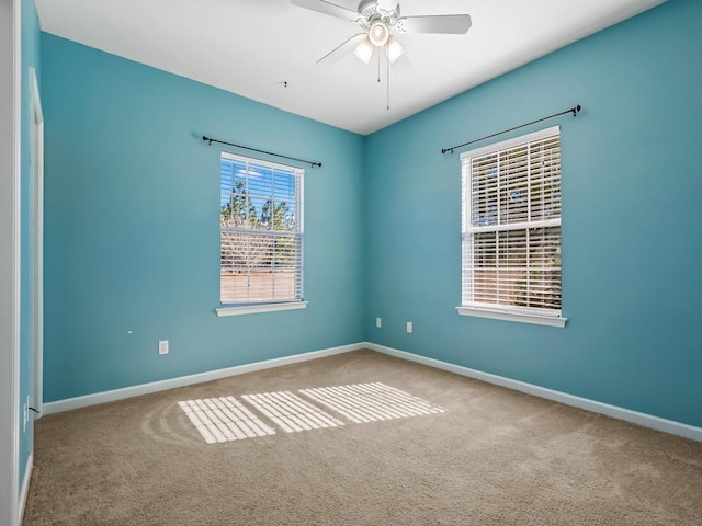 carpeted empty room with ceiling fan