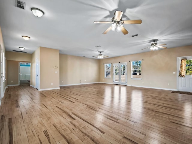 unfurnished living room with light wood-type flooring