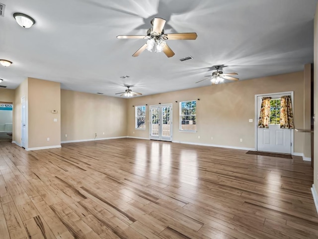 unfurnished living room with light hardwood / wood-style floors