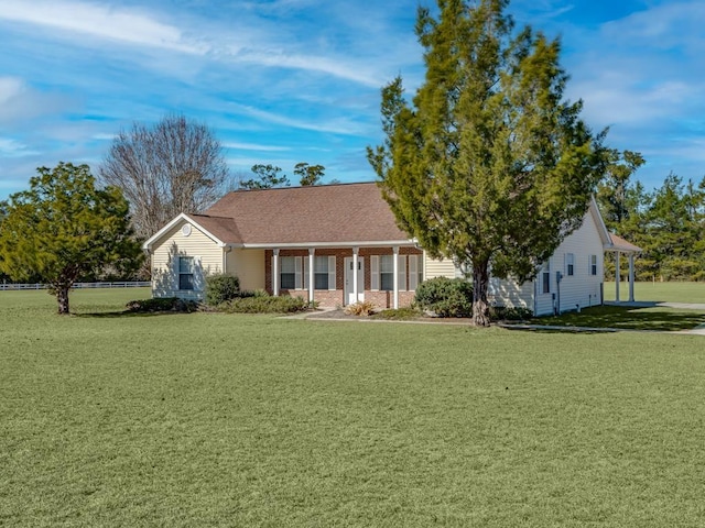 ranch-style house featuring a front yard and a porch