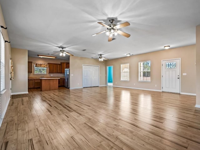 unfurnished living room with light hardwood / wood-style flooring