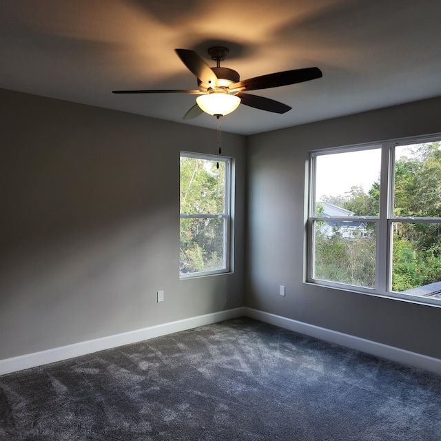 empty room with carpet and ceiling fan