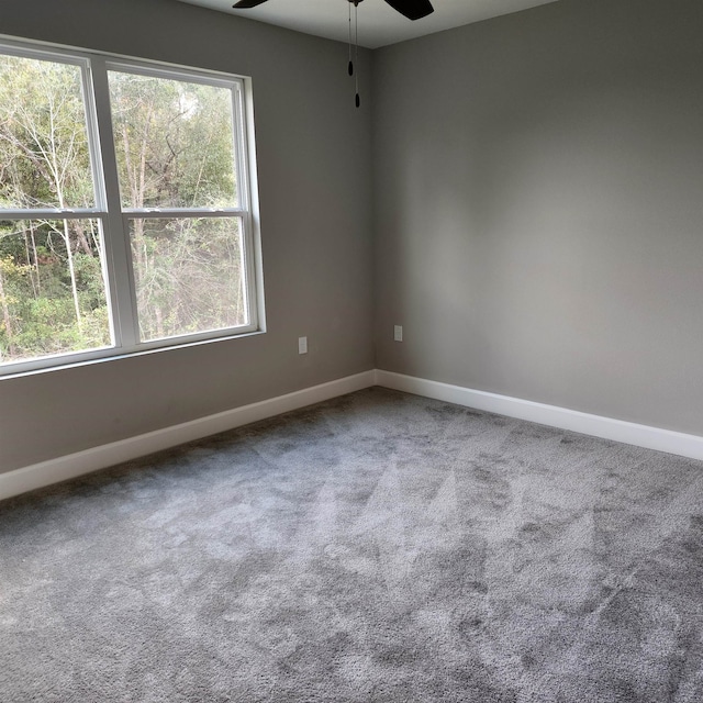 carpeted empty room with ceiling fan