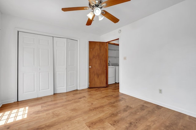 1355 Warrior Way Unit 67, Tallahassee, FL 32304 - unfurnished bedroom featuring washing machine and dryer, light wood-style floors, a closet, and baseboards