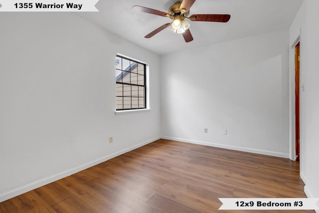 1355 Warrior Way Unit 67, Tallahassee, FL 32304 - empty room featuring wood finished floors, baseboards, and ceiling fan