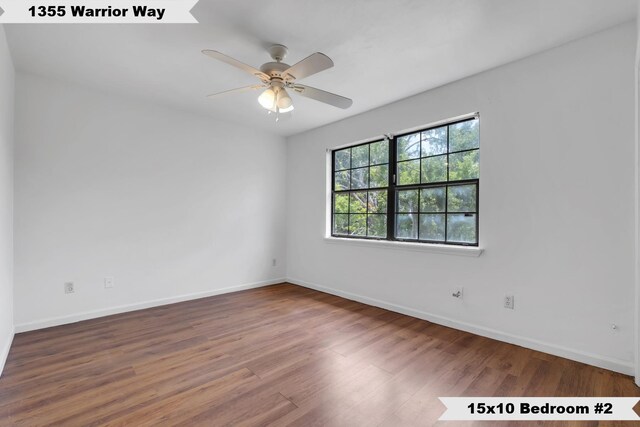 1355 Warrior Way Unit 67, Tallahassee, FL 32304 - empty room with wood finished floors, baseboards, and ceiling fan